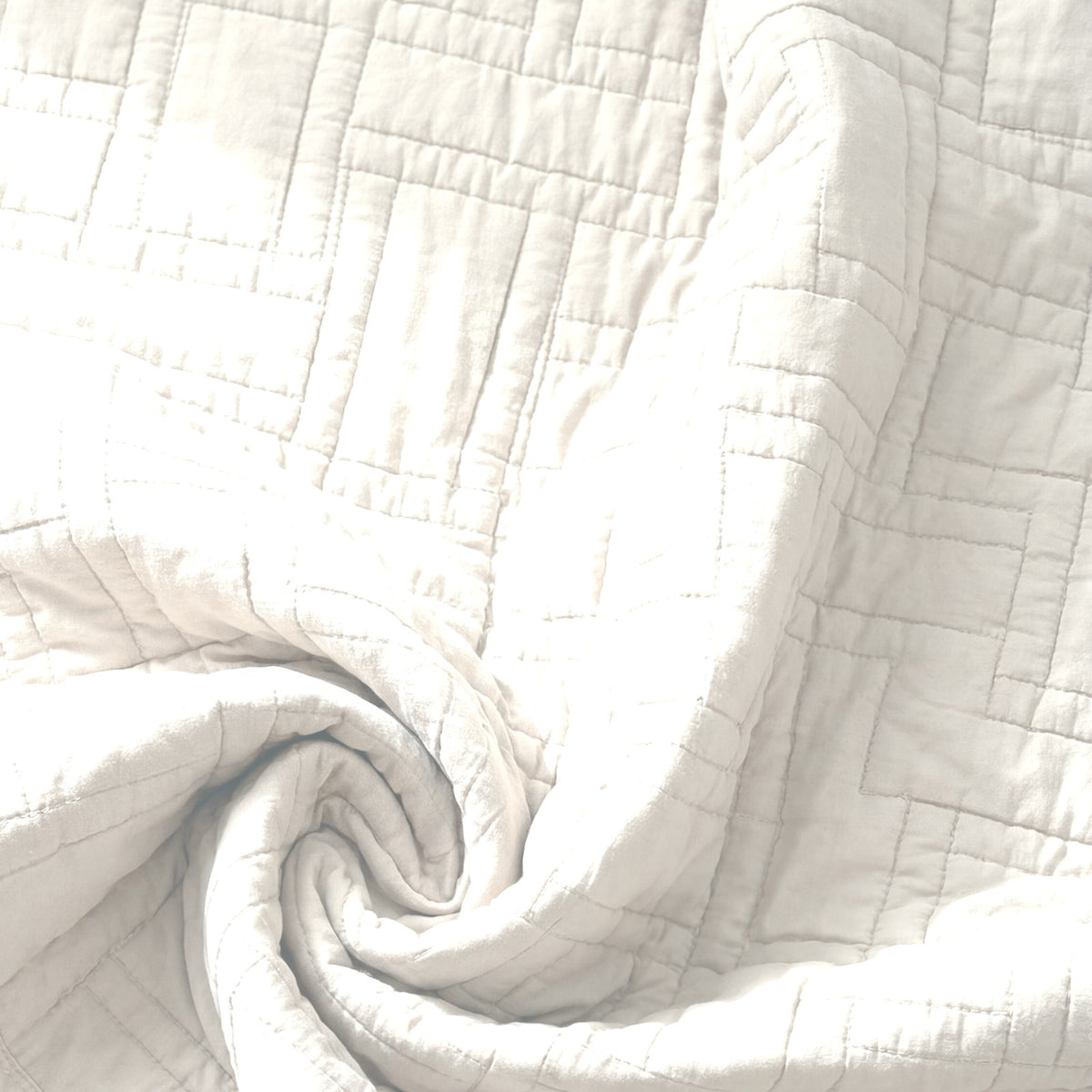 The Luxor Heritage Grid Quilt in Ivory Mist: fabric close-up, color preview